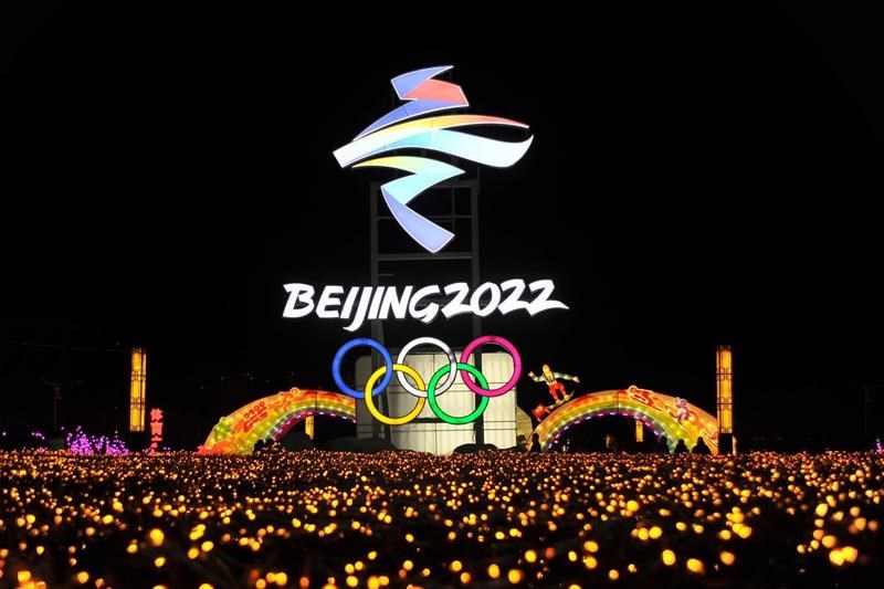 Beijing 2022 logo above city of lights