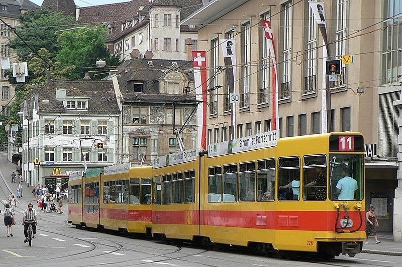 BLT tram Line 11 on track along road in Basel